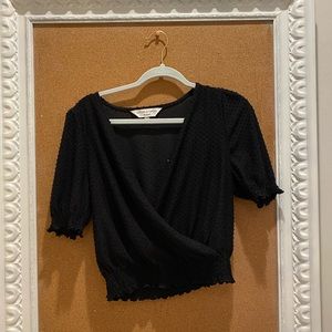 Women’s black, textured, blouse.